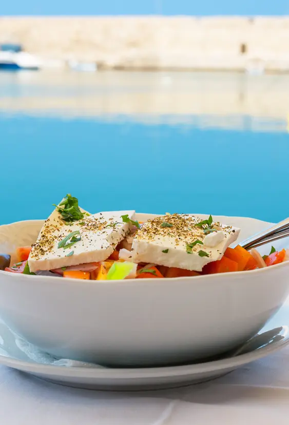 Greek Salad With Feta Cheese On Table. Rethymno, Crete, Greece Shutterstock 182135753