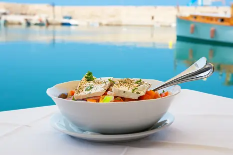 Greek Salad With Feta Cheese On Table. Rethymno, Crete, Greece Shutterstock 182135753