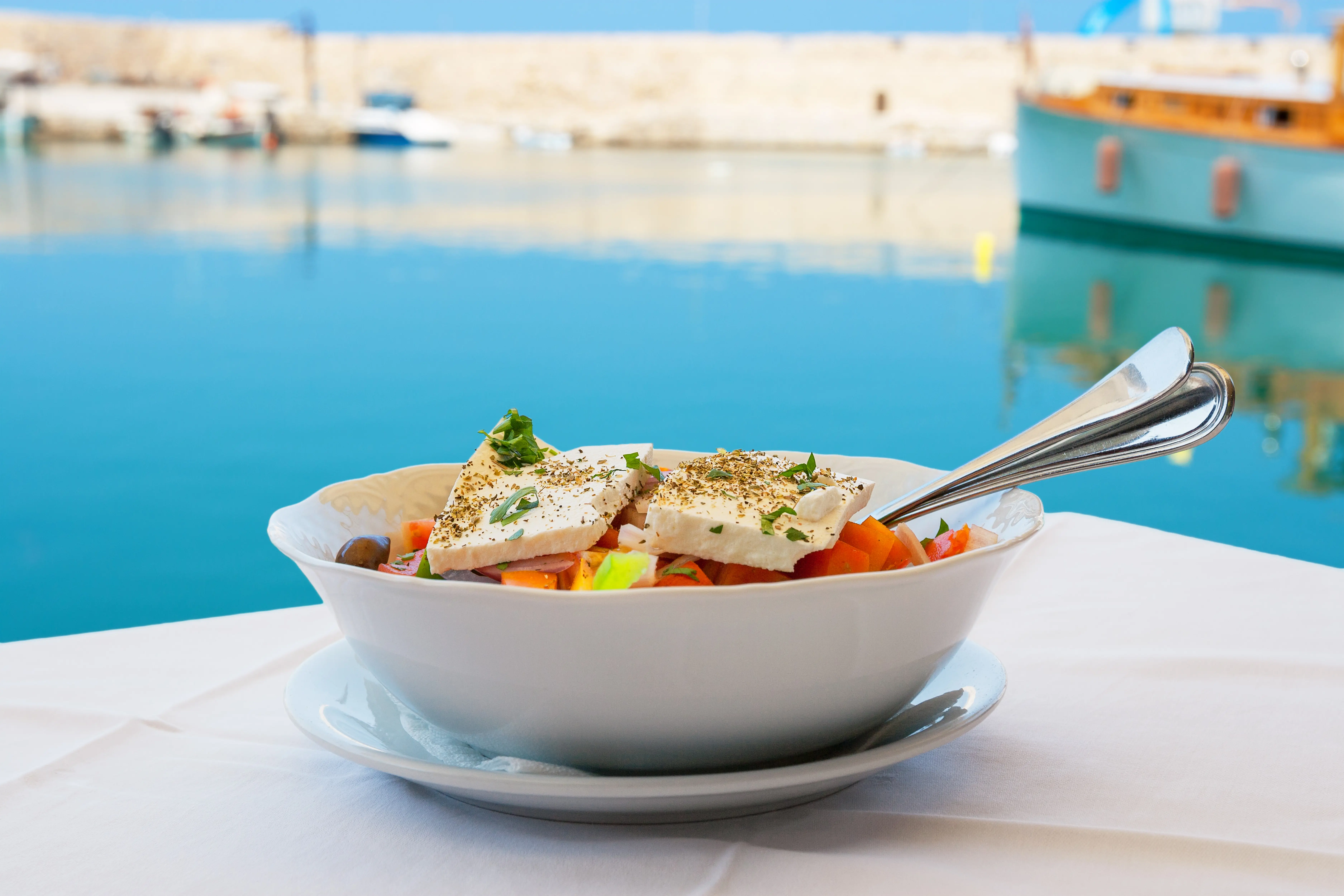 Greek Salad With Feta Cheese On Table. Rethymno, Crete, Greece Shutterstock 182135753