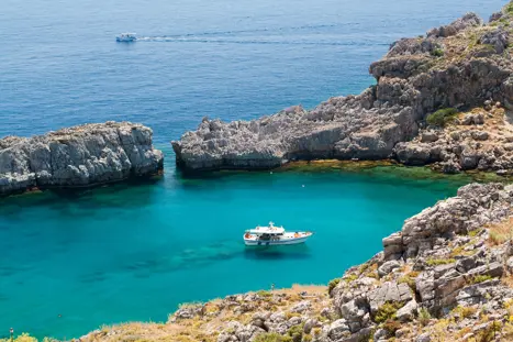 Blue Ship In Bay Agios Pavlos, Cove Agios Pavlos, Island Rhodes, Greece 271486034.Jpg.Crdownload